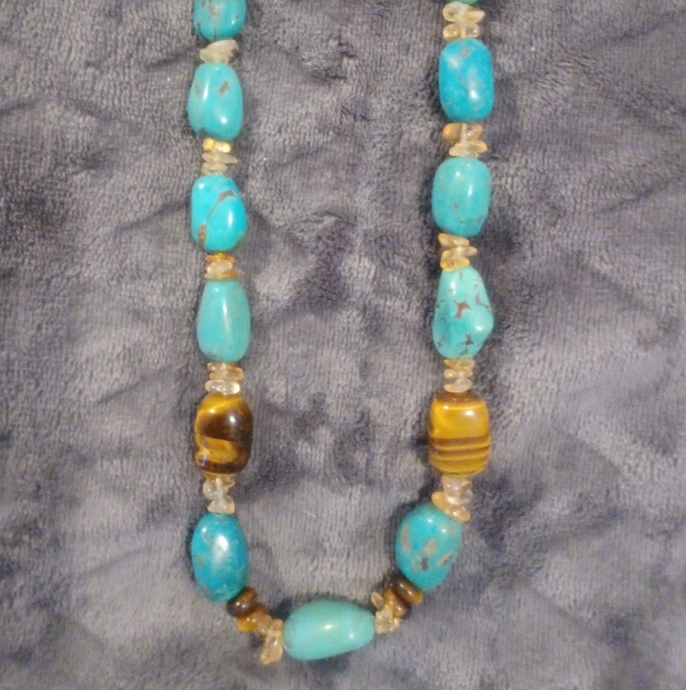 Turquoise, chunky bead and I'm not sure of the other gemstones. 20 inches total